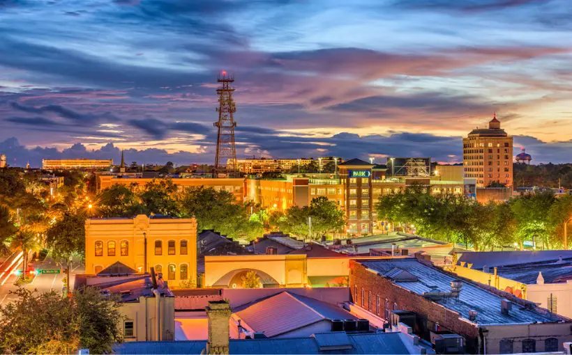 A long-range exterior view of the Gainesville city skyline at twilight