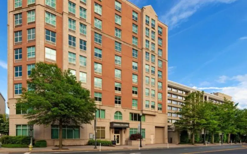 Exterior view of brick mid rise hotel and front entrance