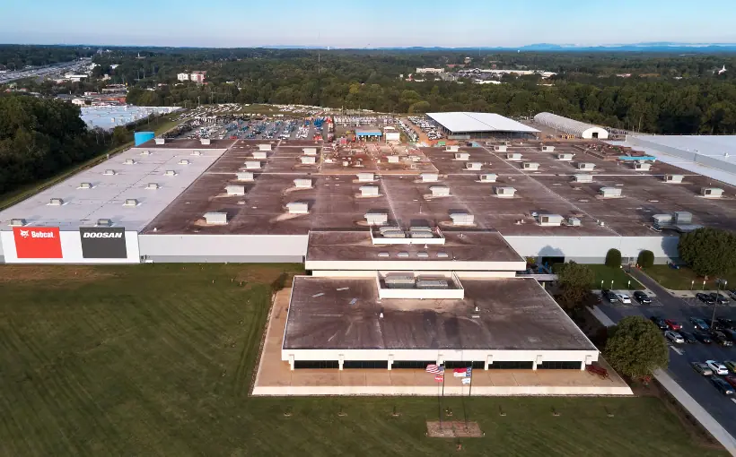 Bobcat Company Finishes $70M Manufacturing Facility Expansion in Statesville Bobcat Company has completed the $70-million expansion of manufacturing facility in Statesville, NC. The investment makes the location the company’s largest manufacturing facility in North America and will add hundreds more jobs in Iredell County over the next five years. The 600,000-square-foot expansion increases the footprint to more than 1 million square feet on a more than 150-acre campus at 1293 Glenway Drive. There is additional space for manufacturing and warehousing; research and development; an automated paint line; parts control and storage; shipping and receiving docks; open air space for product testing and quality control; additional parking; shipping and delivery entrance; and finished goods inventory storage. The manufacturing space includes new technology to improve production efficiencies and streamline operations across Bobcat's North American locations. New factory technology and systems are consistent across the company's North American facilities for improving process and design collaboration as well as for simplifying transfer of information. https://www.bobcat.com/na/en/ 1293 Glenway Dr Statesville, NC 28625 Bobcat Company has completed a $70-million expansion of its manufacturing facility in Statesville, NC.