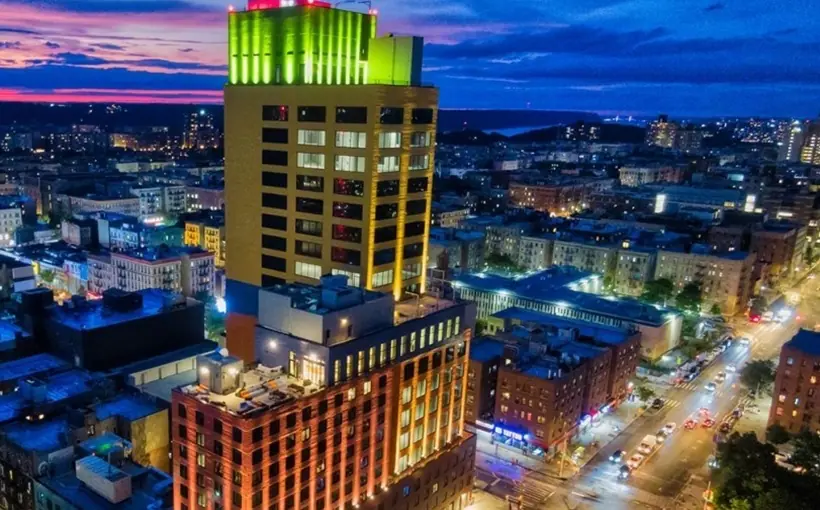 Manhattan Property Group negotiated a lease at Youngwoo's Washington Heights development for Banreservas' second bank branch in the U.S.