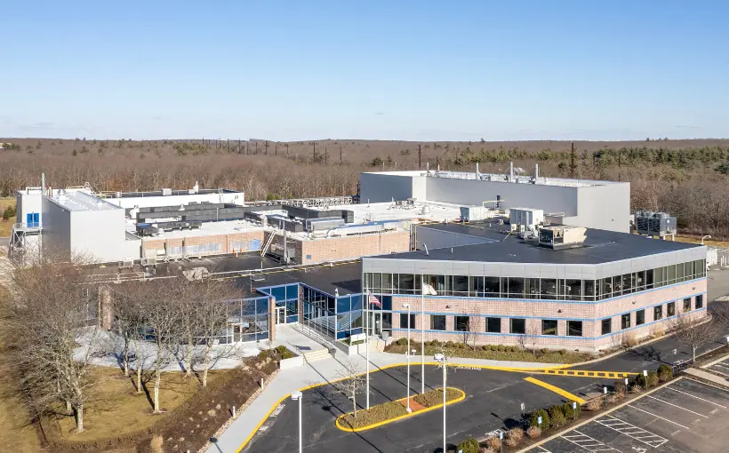 The Davis Companies has acquired an improved 122,000-square-foot biomanufacturing facility at 100 Technology Way and a 15.5-acre adjacent development parcel in Smithfield, RI.