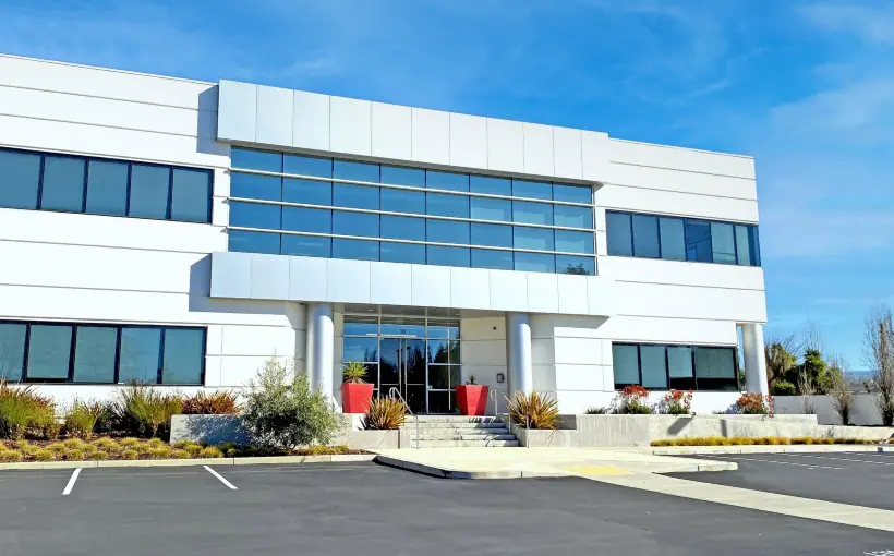 Drawbridge Realty has brought its five-building Rose Orchard office campus in San Jose to 100% leased by signing global semiconductor company NXP