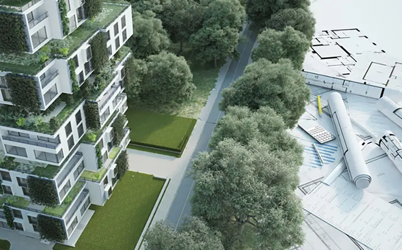 Green building with blueprint and design supplies