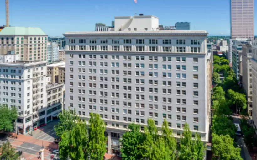Menashe Properties Buys American Bank Building for $13.6M